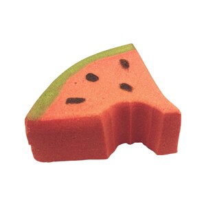 May include: A watermelon-shaped sponge with a bite taken out. The sponge is red with black seed details and a green rind. The image is set against a white background.