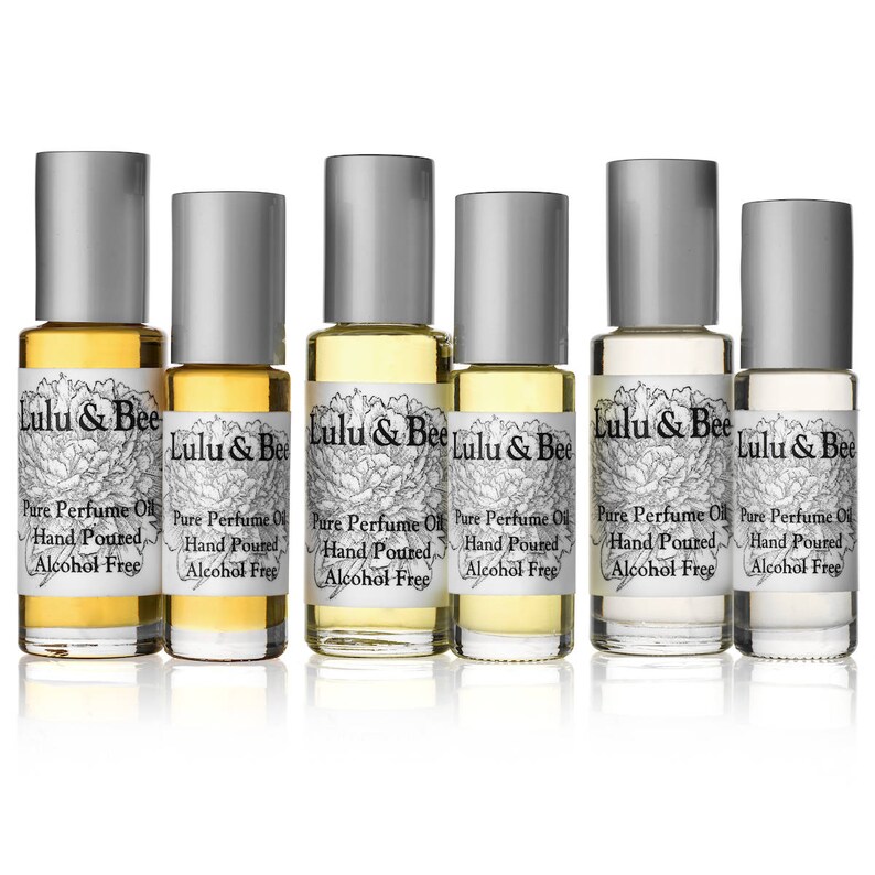 May include: Six glass bottles of alcohol-free perfume oil, labeled "Lulu & Bee Pure Perfume Oil Hand Poured Alcohol Free".