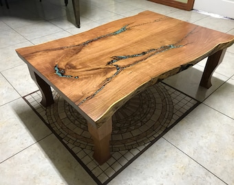 Mesquite coffee table with inlayed turquoise stones and wooden legs
