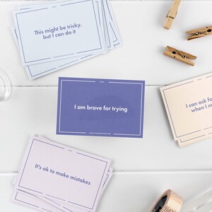 May include: A set of affirmation cards for kids with positive messages like "This might be tricky, but I can do it", "I am brave for trying", and "It's ok to make mistakes".