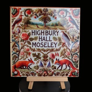 May include: A ceramic tile with a colourful floral design featuring two foxes, birds, and a tree. The tile has the text "Highbury Hall Moseley" in the centre.