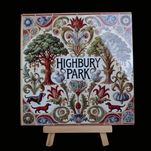 May include: A ceramic tile with a colourful floral design and two dachshunds. The tile features the words "Highbury Park" in a decorative font.