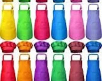 May include: Set of 10 colorful chef hats and aprons for kids. The hats are white with a colorful band and the aprons are solid colors.
