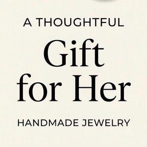 May include: Cream-colored background with black text that reads "A Thoughtful Gift for Her" and "HANDMADE JEWELRY". The text is in a classic serif font, suggesting a focus on handcrafted jewelry.