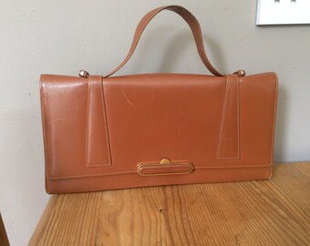 Vintage tan leather clutch/hand bag with purse and mirror.