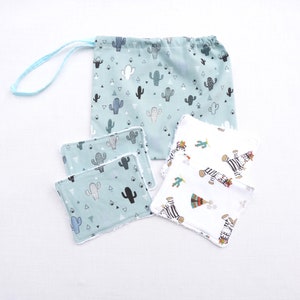 May include: A set of reusable facial rounds and a matching drawstring bag. The bag and rounds feature a light teal background with a cactus pattern in black, white, and grey. Additional rounds have a zebra print.