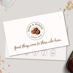 May include: A white gift card with a brown logo that says "Bean & Bloom Coffee Shop" and the text "Good things come to those who brew."