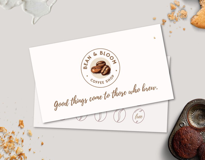 May include: A white gift card with a brown logo that says "Bean & Bloom Coffee Shop" and the text "Good things come to those who brew."