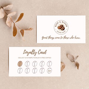 May include: A white loyalty card with a brown coffee bean design. The card says "Loyalty Card" and "Collect 10 stamps to enjoy a free coffee!" There are 10 circles on the card, one of which is filled in with a brown coffee bean. The last circle says "free".
