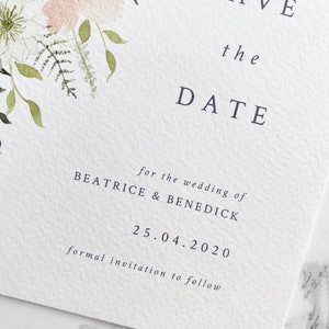 Close up of text on A6 portrait save the date. Text is printed in grey and aligned right in a modern and minimal style. Font is a classic serif font.