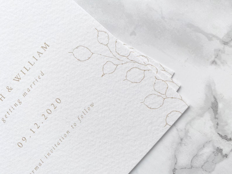 Close up of illustration detail on bottom corner of wedding save the date cards. Hand drawn honesty branches in delicate line drawing style with minimal and modern text layout.