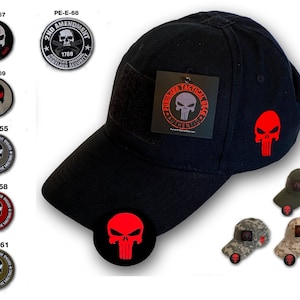 May include: Black baseball cap with a red skull patch and a velcro patch that says "Punisher Tactical Gear Authentic".