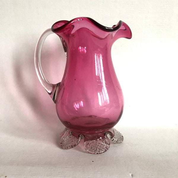 A pretty Victorian posy or milk jug. Rich cranberry glass.