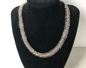 A vintage feather silver look necklace