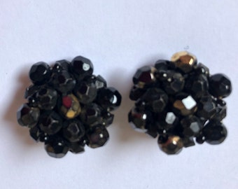 Black cluster clip on earrings with slight gilding on a few beads to lift the look.