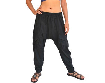 May include: Black harem pants with a loose, flowing fit and side pockets. The pants are made of a soft, comfortable fabric.