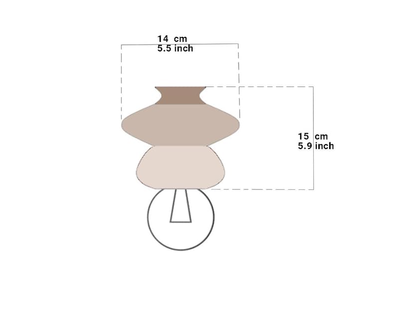 May include: A brown and beige ceramic lampshade with a round, layered design. The lampshade is 5.5 inches tall and 5.9 inches wide.