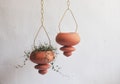 Pair of Hanging Ceramic Planters, Terracotta Unique Artwork, Handmade Design for Indoor and Outdoor product logo