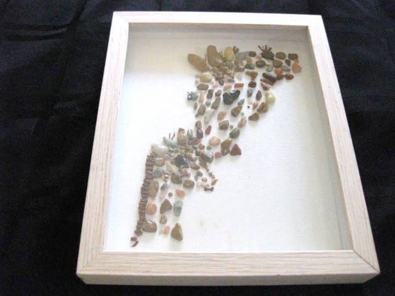 Mother Giraffe kissing her baby made with Rocks
