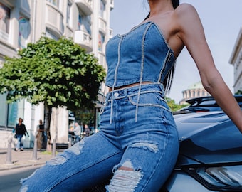 Rhinestone Jeans and denim top strapless is festival outfit clothing.