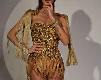 Rave costume gold corset with feather skirt and shoulder epaulettes, burning man costume. Cleopatra costume