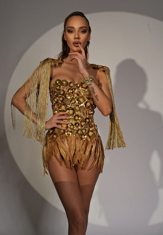 Rave costume gold corset with feather skirt and shoulder epaulettes, burning man costume. Cleopatra costume