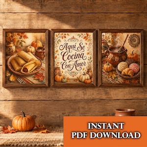 May include: A set of three framed wall art prints featuring autumn-themed illustrations. The left print shows tamales on a plate, the center print displays the text "Aquí Se Cocina Con Amor" with pumpkins, and the right print depicts a clay pot and pastries.