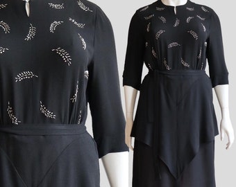 Vintage 1940s | XL/XXL | Rayon crepe peplum dress with prong set metal studs and rhinestones.