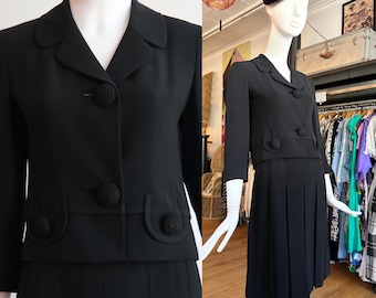 Vintage 1960&#39;s | Small | Chic rayon gabardine skirt suit with large crocheted buttons and flirty box pleated skirt.