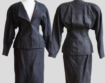 Vintage 1980’s | Medium | Bodacious Charcoal leather skirt suit.