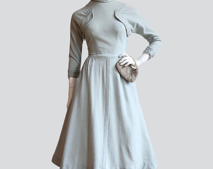 Featured listing image: Vintage early 1950’s | Medium | Elegant light sage, wool jersey dress decorated with rhinestones, full skirt with pockets.
