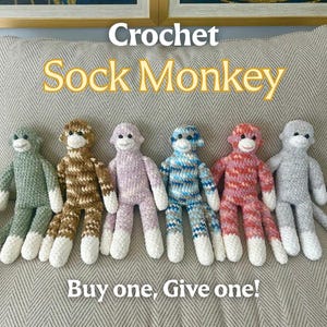 May include: Six handmade crochet sock monkey plush toys arranged in a row. The monkeys feature various colours including sage green, brown, lavender, blue, pink, and grey, all with white faces, hands, and feet. Text reads: Crochet Sock Monkey Buy one, Give one!