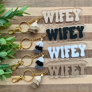 May include: A rustic wooden sign with the text "Welcome to our home" in white lettering. The sign features a distressed finish and a simple, inviting design, perfect for a front porch or entryway.