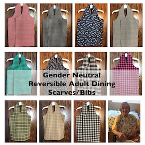 May include: A collection of reversible adult dining scarves/bibs in various patterns and colors, including red gingham, black and white check, navy with white anchors, and green plaid. The text "Gender Neutral Reversible Adult Dining Scarves/Bibs" is displayed.