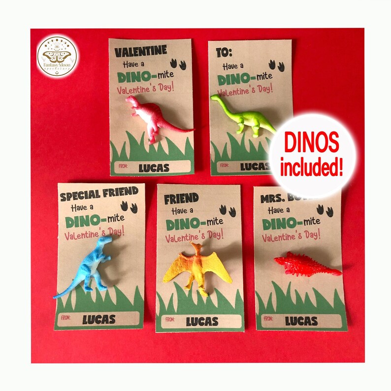 May include: Five brown cardstock Valentine's Day cards with dinosaur toys attached. Each card has a different message, including "Valentine", "To", "Special Friend", "Friend", and "Mrs. B". The cards have green grass at the bottom and the text "Have a DINO-mite Valentine's Day!" Each card has the name "Lucas" at the bottom. The text "DINOS included!" is written in red on a white circle.