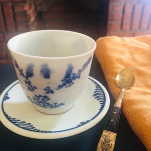 Blue and white cup and saucer