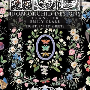 May include: Black background with floral and butterfly designs. The text reads "IRON ORCHID DESIGNS TRANSFER EMILY CLARE EIGHT 8" x 12" SHEETS". Decorative elements include butterflies, flowers, and banners with text.