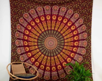 May include: A maroon tapestry with a large, colorful mandala design. The mandala features shades of red, orange, yellow, green, and blue. The tapestry is hanging on a white wall.