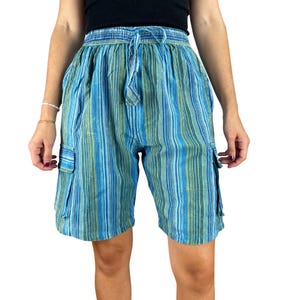 May include: Blue and green striped cargo shorts with a drawstring waist. The shorts have two side pockets and are made of a lightweight fabric. The vertical stripes alternate between shades of blue and green.