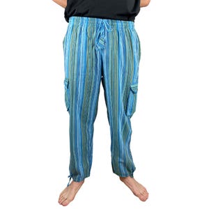 May include: Blue and green striped cargo pants with a drawstring waist and two side pockets. The pants have a relaxed fit and are made of a lightweight fabric. The bottom of the pants have drawstrings.