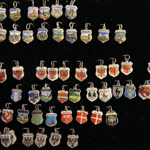 Vintage Austria Travel Shields and Hand Painted Charms in 800 835 silver 1940s to 1950s each Sold Separately New charms Jan 11, 2024