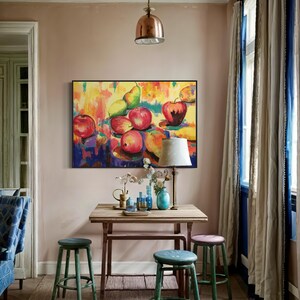 May include: A colorful still life painting of fruit, including apples, pears, and lemons, hanging on a wall in a room with a wooden table and green stools.