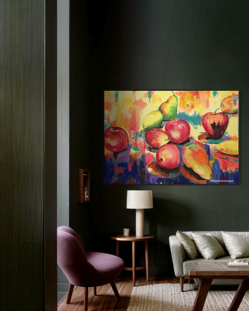 May include: A colorful abstract painting of a still life with apples, pears, and a banana on a yellow background. The painting is framed and hanging on a dark green wall in a living room.