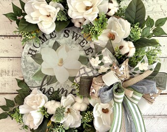 Corona de magnolia, algodón y vid, decoración para puertas de casas sureñas.