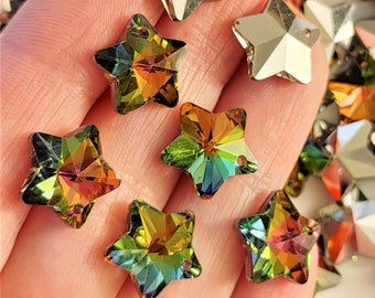 May include: Assortment of iridescent star-shaped crystal beads with a hole for stringing. The beads are a mix of green, gold, and red.