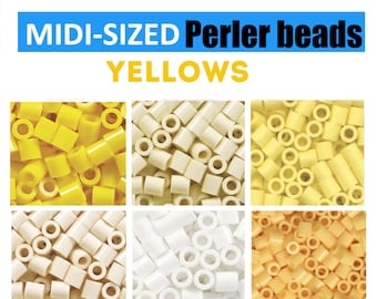 May include: An assortment of yellow and off-white midi-sized Perler beads. The image features six different shades of yellow beads, including bright yellow, cream, and pale yellow. The text "MIDI-SIZED Perler beads YELLOWS" is displayed at the top.