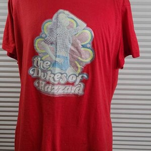 1970's Touched by Time Daisy Duke T Shirt. 20" Pit to Pit Measurement. 20" Length.