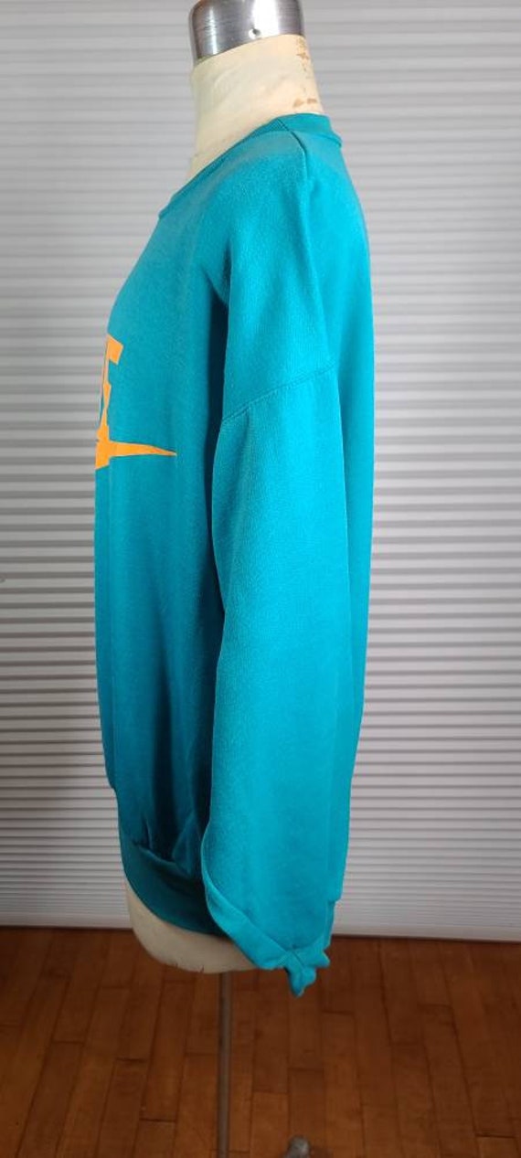 orange and green nike sweatsuit