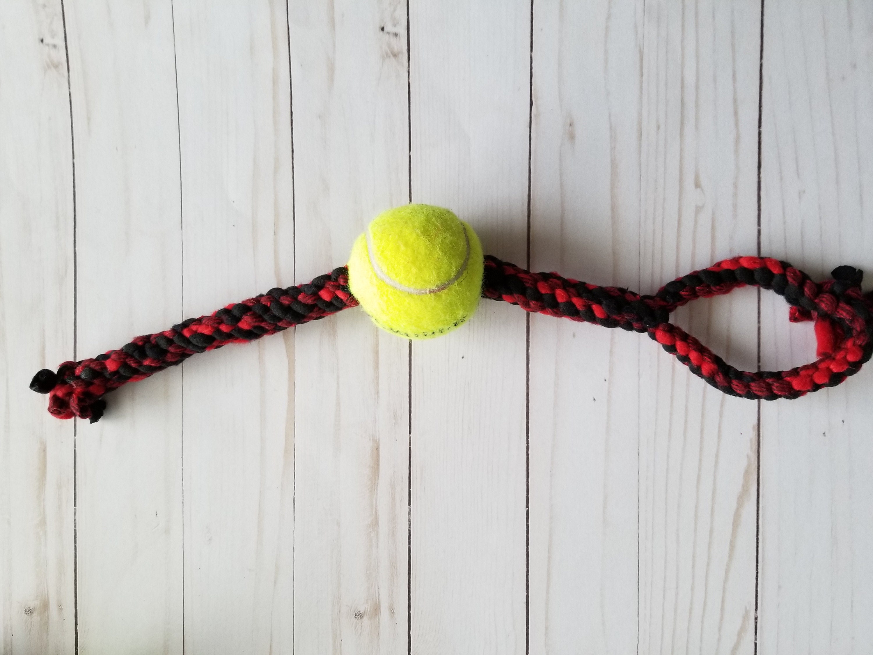 Tennis ball top with rope