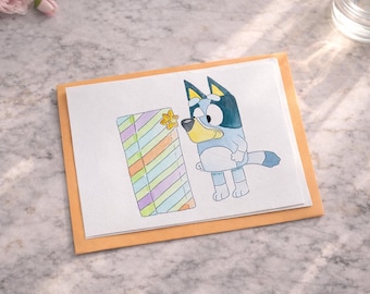 Tarjeta de felicitación de acuarela Bluey: Cumpleaños Bluey con regalo